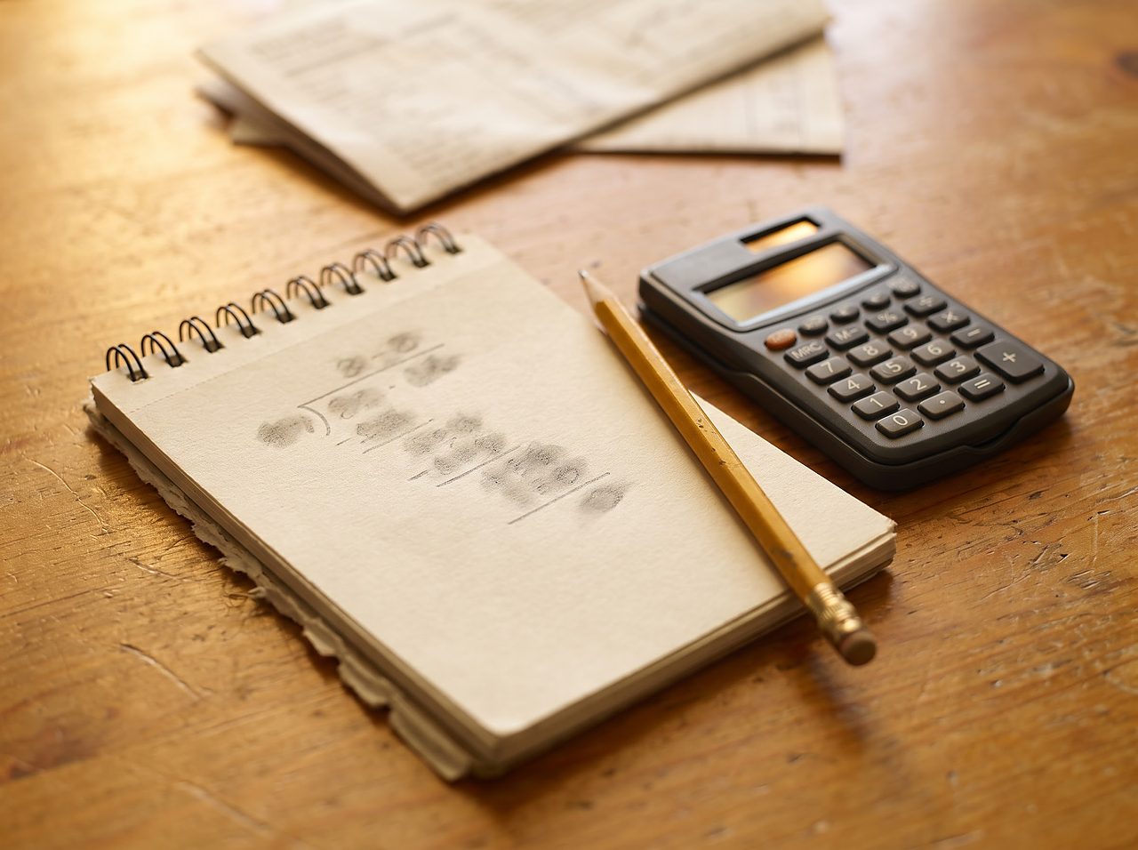 notepad and calculator showing a simple hardness conversion calculation in progress