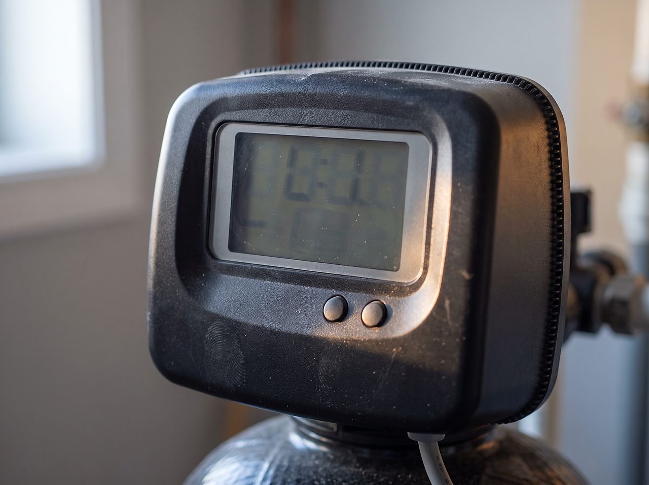 close view of a softener control head display during a time and power check